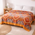 Vendbar quilt med solopgangsmønster